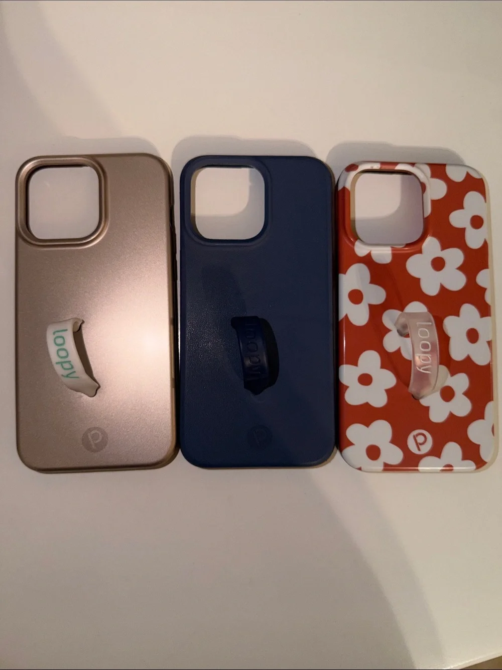 15 Pro Max Loopy Cases: Desert Metallic, Blue- “leather feel” & Auburn Daisies